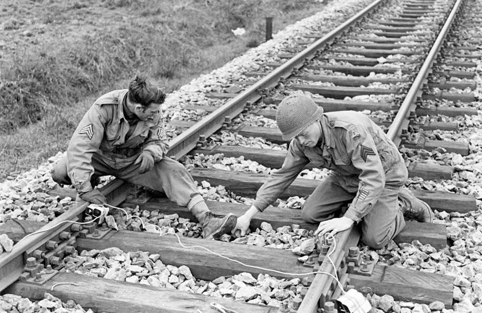 17th Engineers demolition team laying mines under an railway track