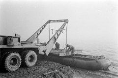 2Unloading treadway bridge sections from Brockway B666 6x6 bridge erector trucks, possibly belonging to 17th AEB