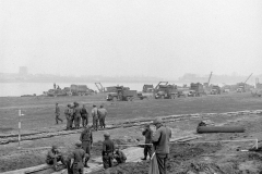 Brockway B666 6x6 trucks of 17th Armored Engineers in the background.