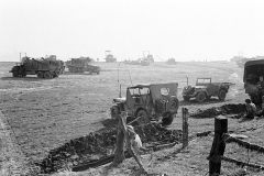 Jeeps of 202nd Engineer Combat Battalion foreground, Brockway B666 6x6 trucks of 17th AEB in the background.