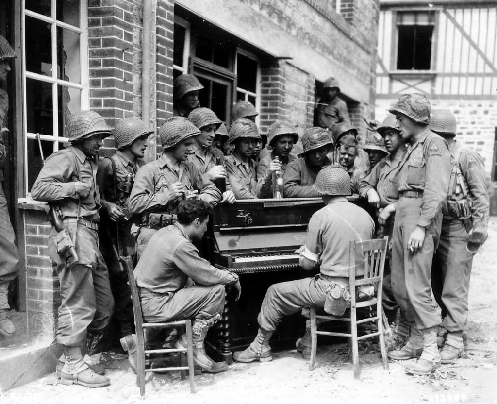  17th Engineers, Barenton France, augst 10, 1944 singing "Go to Town" in the Rue Monteglise, Barenton, France