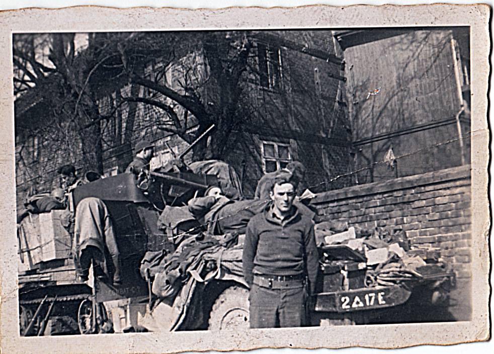 David E. (Edd) Hiett’s, halftrack. Germany, January 1945. He is on top cleaning his .50 caliber machine gun